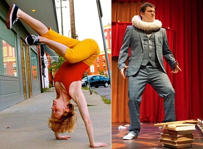 A woman in orange pants and a red shirt does a handstand. A man in a grey suit and caterpillar collar stands on a stage.