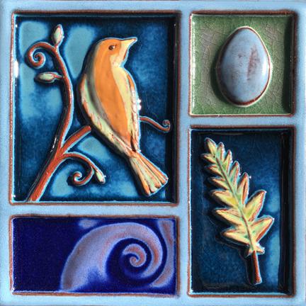 Clay tile featuring an orange bird, a blue egg, a leaf, and a purple wave