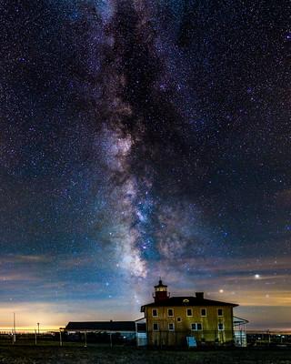 Photo of the Milky Way in the night sky above a large house